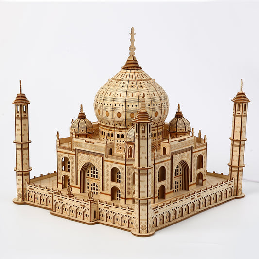 Wooden model of the Taj Mahal on a white background