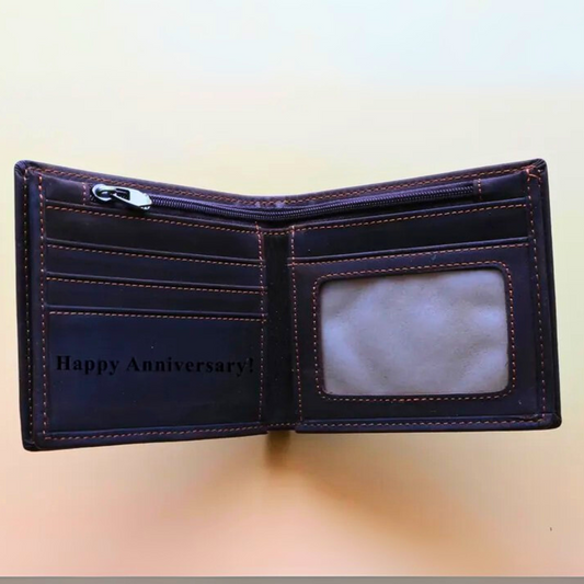 Open leather wallet with 'Happy Anniversary!' engraved inside, perfect as anniversary gift.