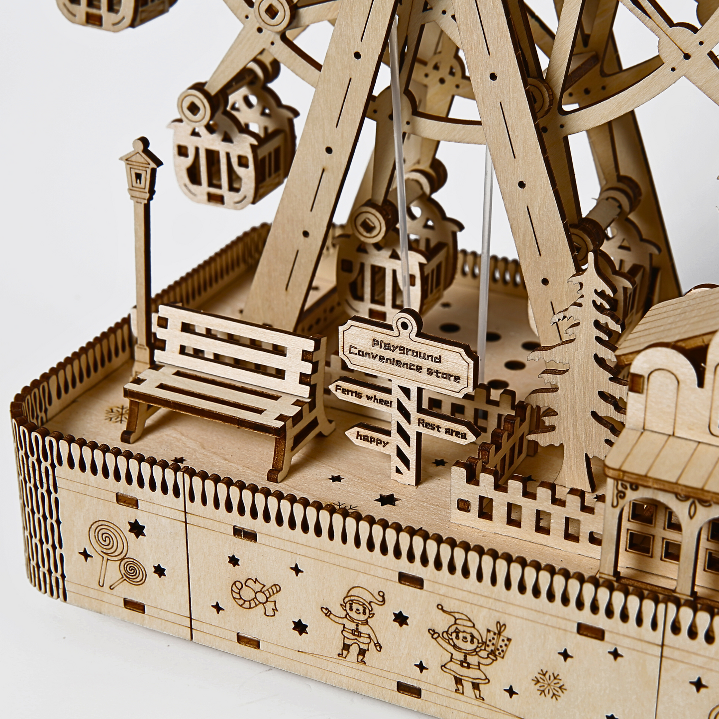 Wooden model of a Ferris wheel with detailed design on a white background
