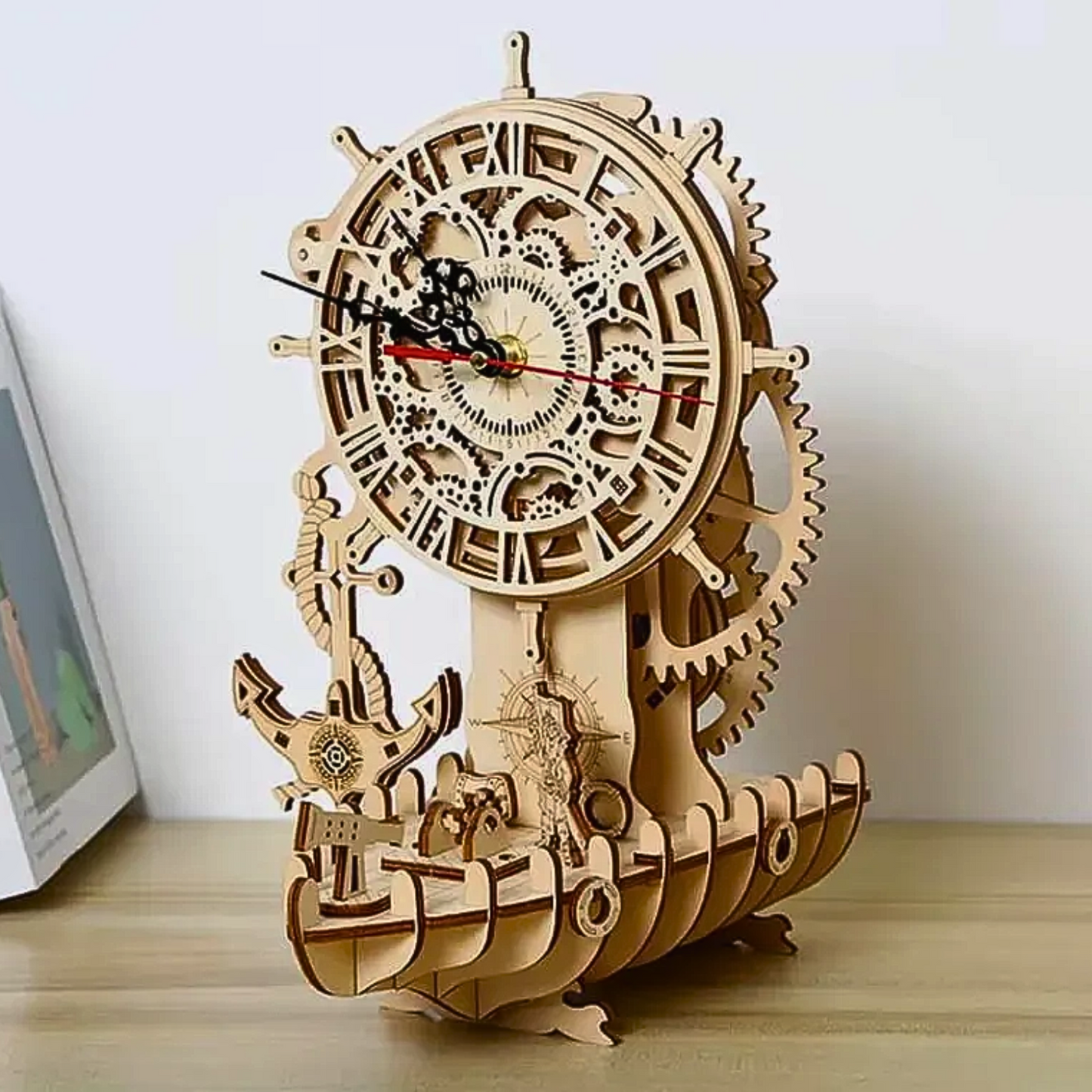 A 3D wooden model puzzle of a pirate boat featuring a clock on top, used as a decorative and functional piece.