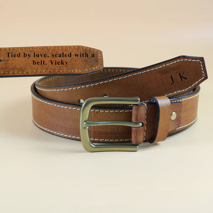 Men's Brown leather belt with gold buckle on a beige background