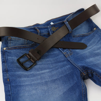 Blue jeans with a black belt on a white background