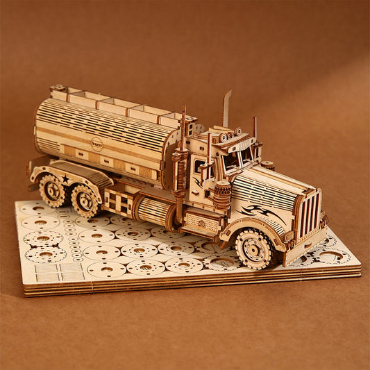 Wooden model of a truck on a matching base with a brown background