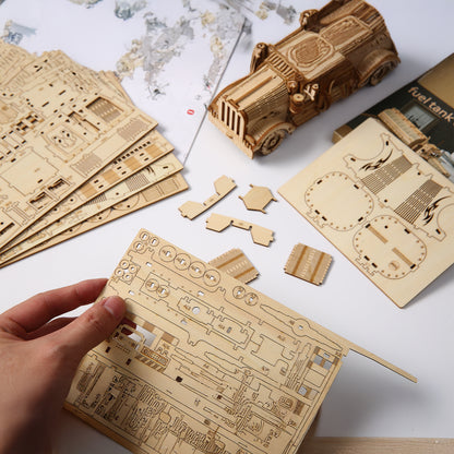 Wooden model kit with laser-cut pieces on a world map background