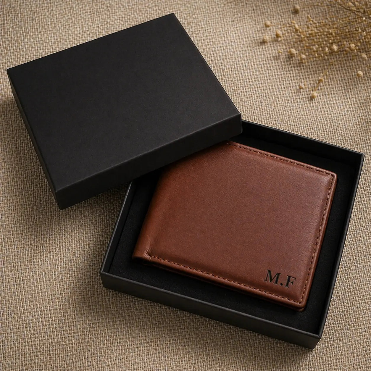 Custom monogrammed men's leather wallet in deep chocolate brown, shown in high-end gift packaging, ideal for anniversaries, birthdays, or Father's Day.
