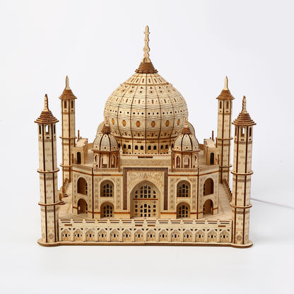 Wooden model of the Taj Mahal on a white background