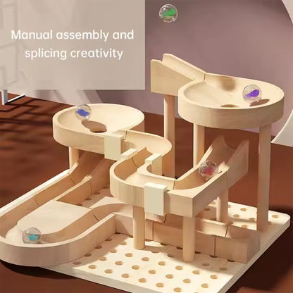 Wooden marble run toy with marbles on a brown surface