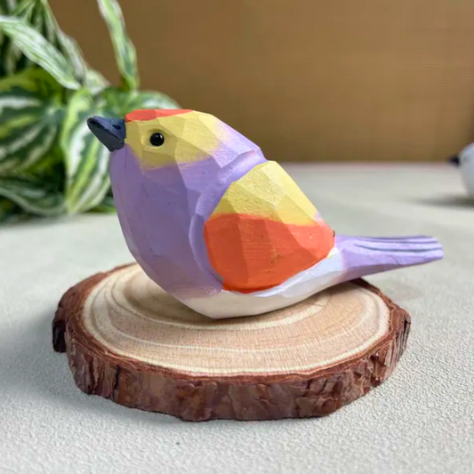 Colorful geometric bird sculpture on a wooden base, used as a beautiful home decor.