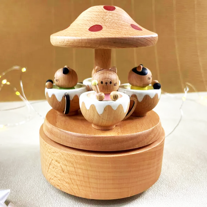 A wooden mushroom-shaped music box toy with cats sitting in teacups, designed as a cute and whimsical decorative piece.