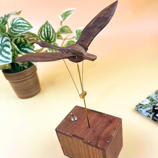 Handmade wooden swan automaton with a music box, for home decor.