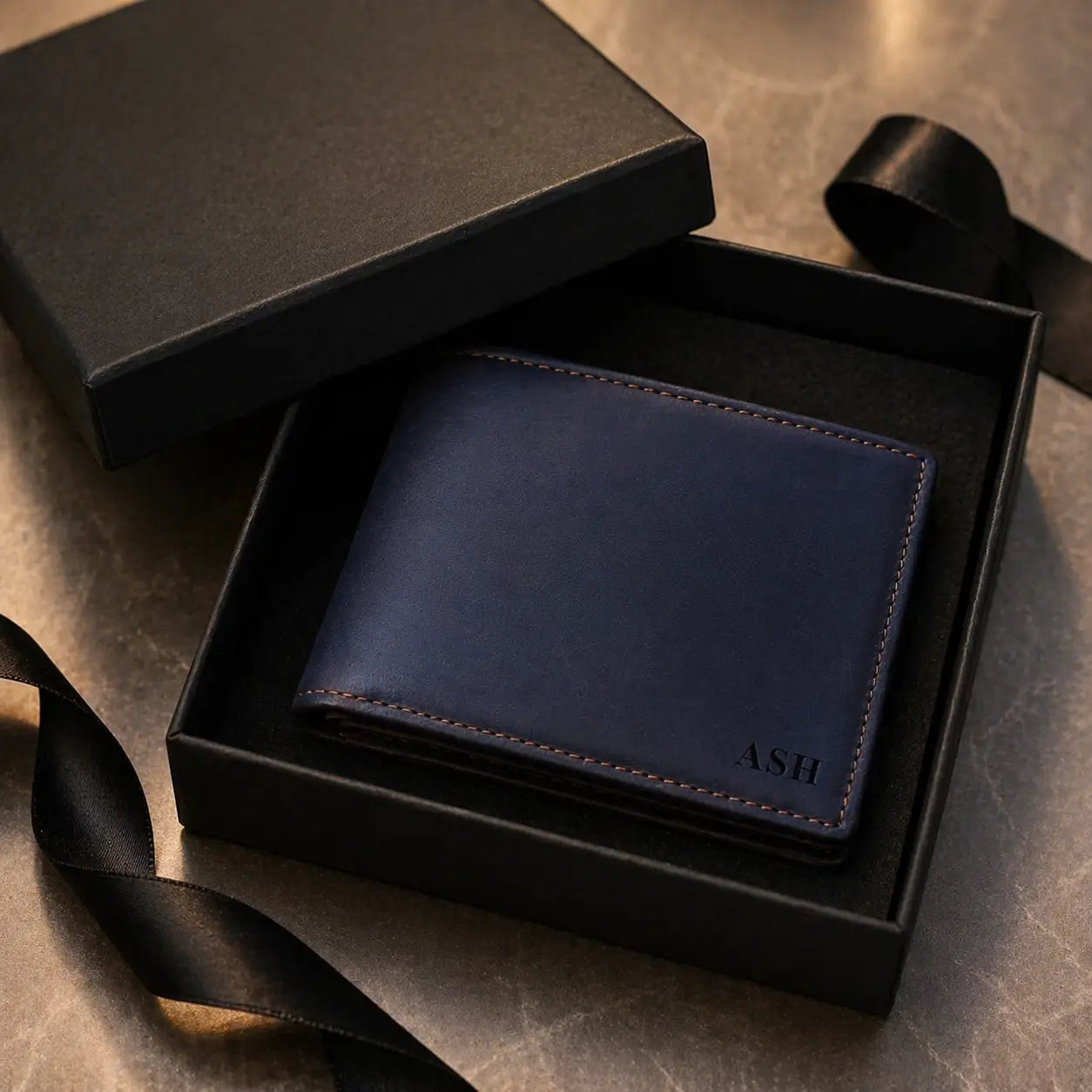 Handcrafted bifold wallet with a smooth leather finish and custom laser-engraved initials, elegantly boxed for a premium unboxing experience.