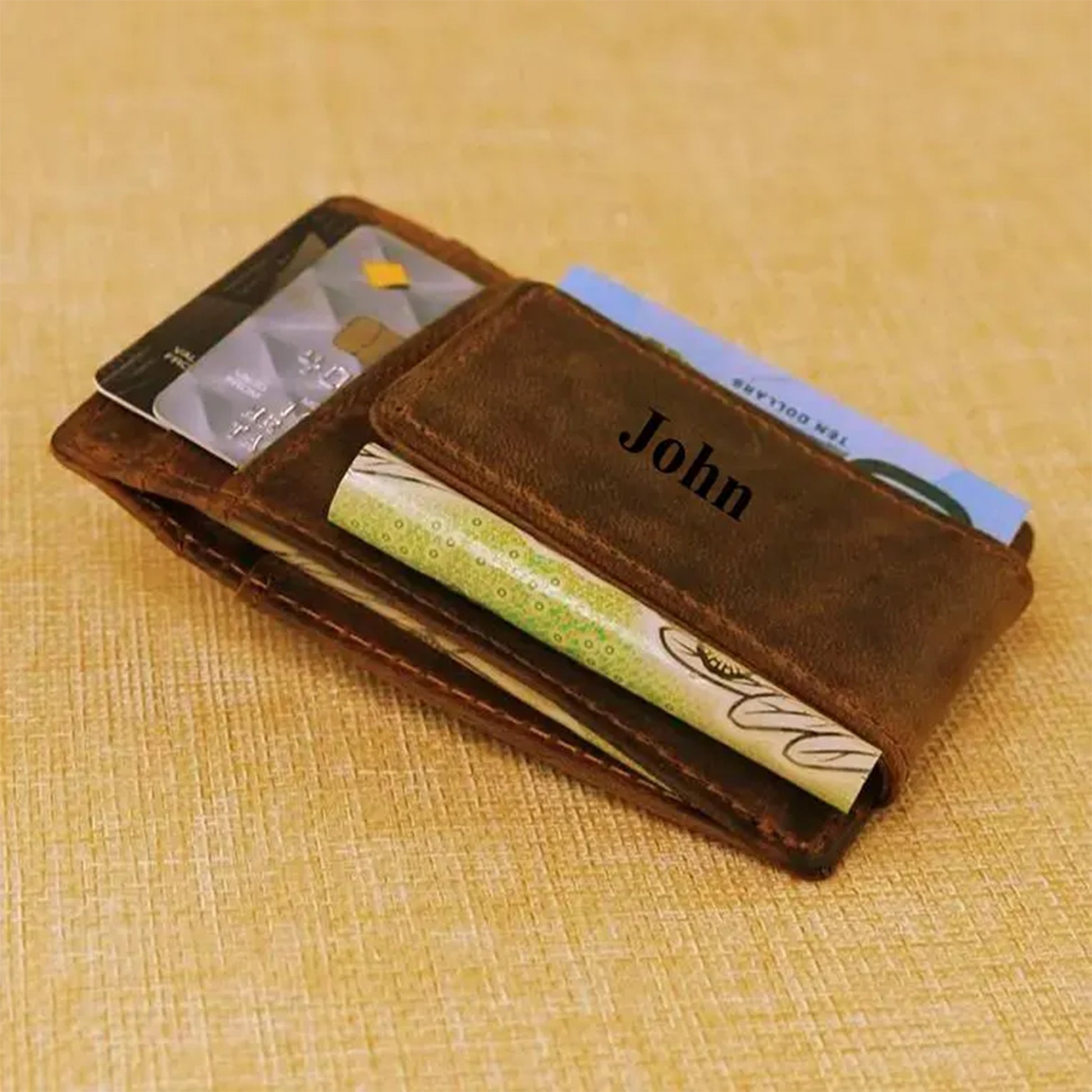 Ultra-slim handmade leather card sleeve for men, showing a compact profile for front-pocket everyday carry.