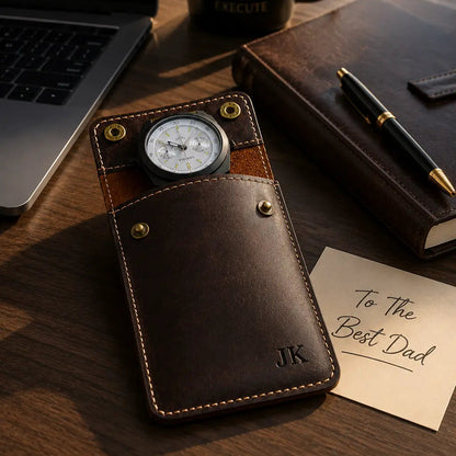 Personalized dark brown leather watch pouch with engraved initials placed on an executive office desk beside a laptop, leather notebook, luxury pen, coffee mug, and handwritten “To The Best Dad” note in warm afternoon lighting.