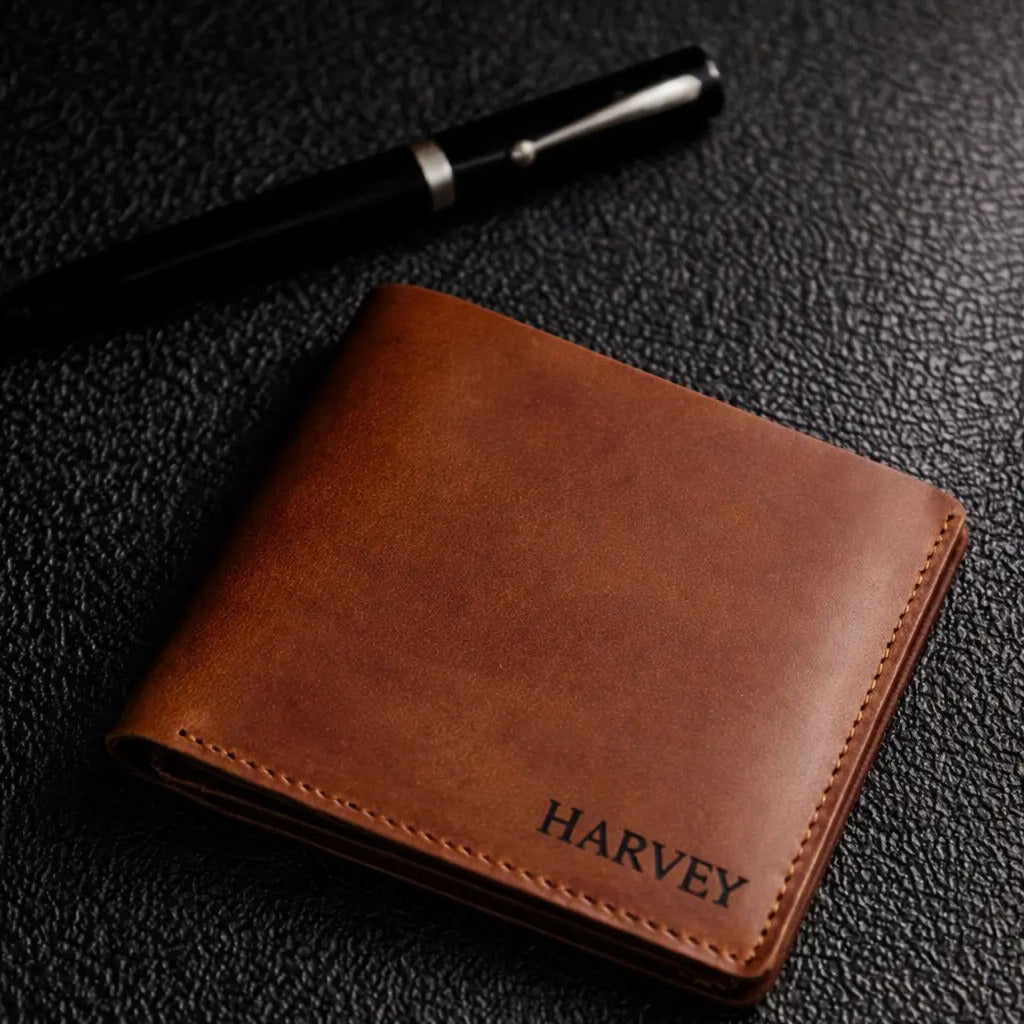 Leather Bifold Wallet full-grain brown leather, hand-stitched seams, burnished edges, personalized engraving, slim classic profile.