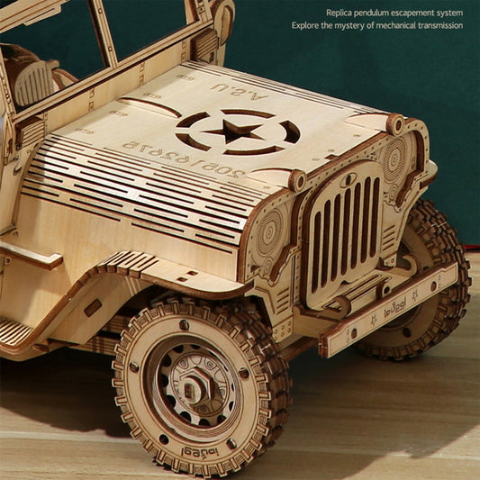 Wooden model of a vehicle with intricate design on a wooden surface