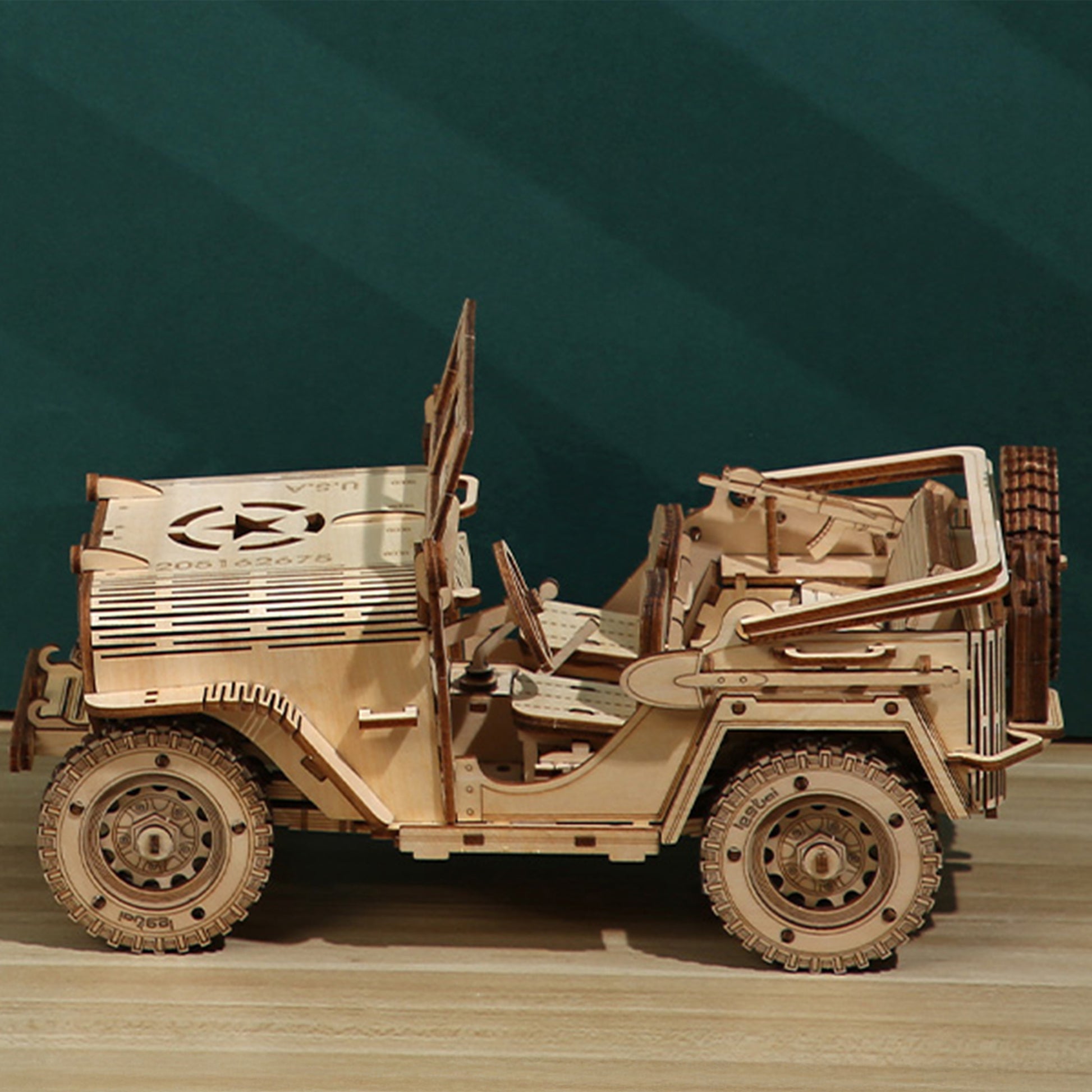 Wooden model of a vehicle on a wooden surface with a green gradient background