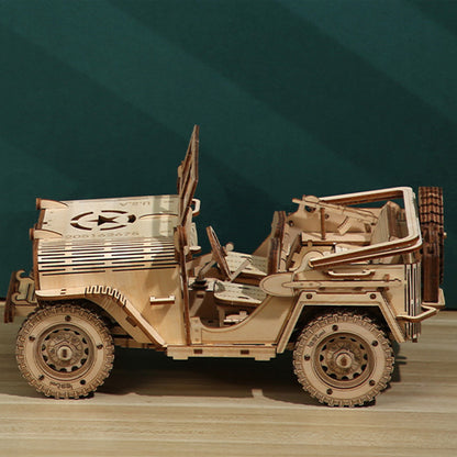 Wooden model of a vehicle on a wooden surface with a green gradient background