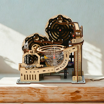 Wooden marble run puzzle model on a wooden surface with a light background