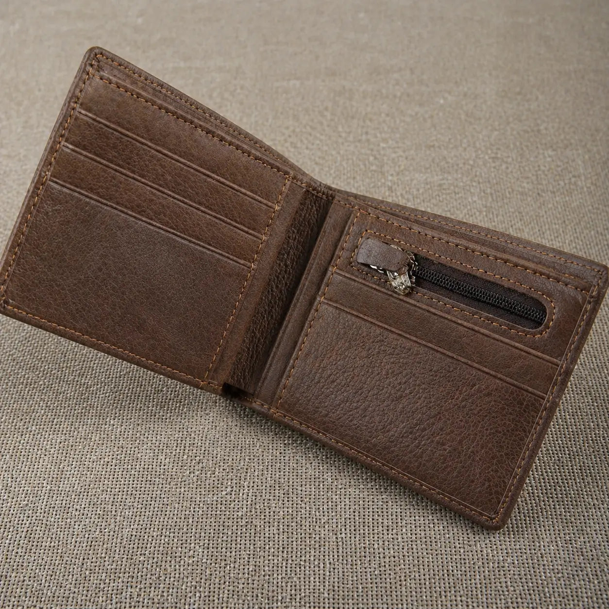 Interior layout of a brown bifold leather wallet showcasing multiple horizontal card slots and a built-in zippered coin pocket for secure storage.
