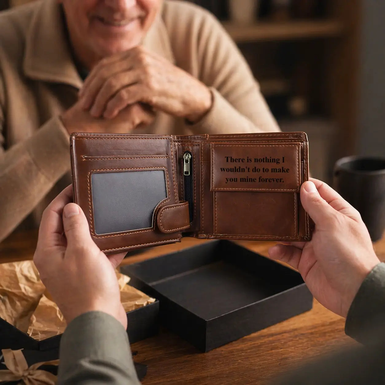 Handcrafted tan leather bifold wallet for men with a secure snap closure, ID window, and internal zipper pocket, shown in a premium gift box.
