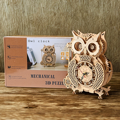 Wooden owl clock mechanical 3D puzzle with packaging on a wooden surface