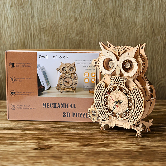 Wooden owl clock mechanical 3D puzzle with packaging on a wooden surface