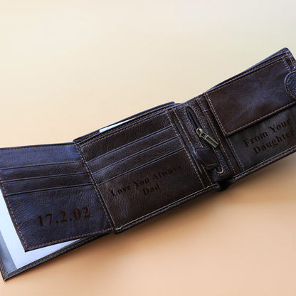 Brown leather wallet with engraved text on a beige background