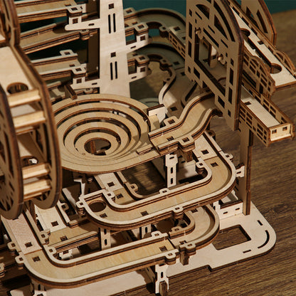 Wooden marble run game puzzle on a wooden surface
