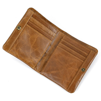 High-capacity tan leather trifold wallet for men, featuring a slim bifold-style opening with durable metal snaps and a natural vintage patina.