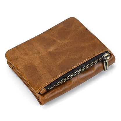 Closed vintage tan leather trifold wallet for men featuring a distressed grain texture and a secure exterior vertical zipper pocket with antique brass hardware.