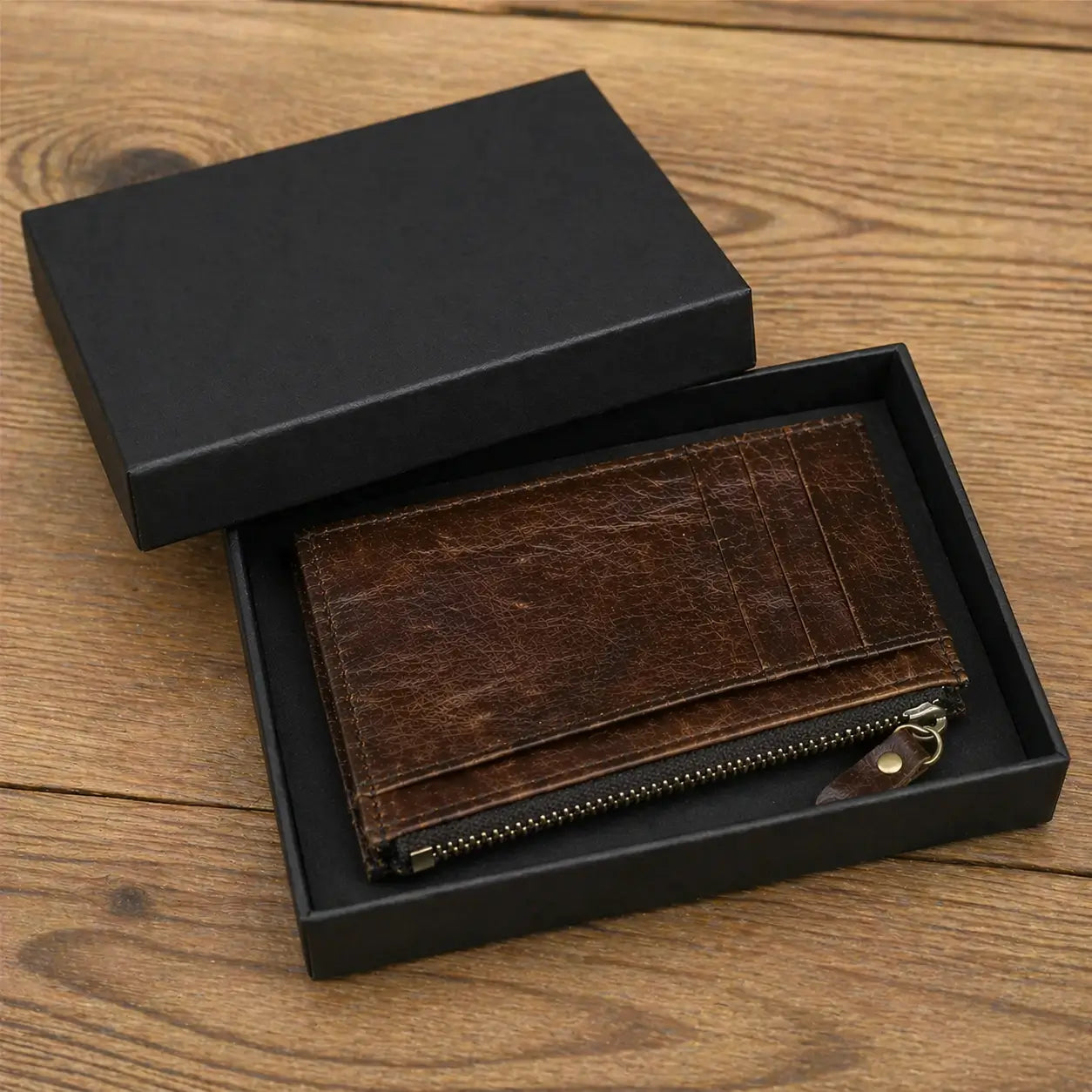 High-quality leather wallet for men in a deep tan finish, shown in premium gift packaging on a textured fabric background, ideal for anniversaries or birthdays.