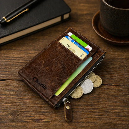 Handcrafted light brown leather wallet for men with an integrated coin purse and personalized laser-engraved interior, shown on a professional wooden surface.