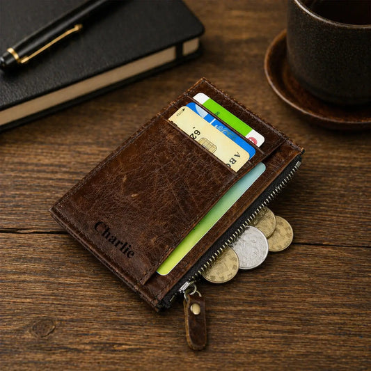 Handcrafted light brown leather wallet for men with an integrated coin purse and personalized laser-engraved interior, shown on a professional wooden surface.
