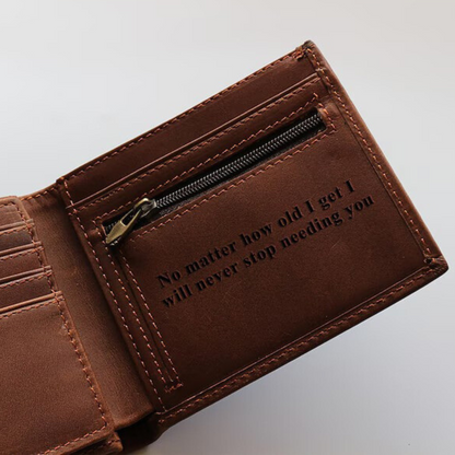 Brown leather wallet with engraved text and a zipped pocket to securely store money.