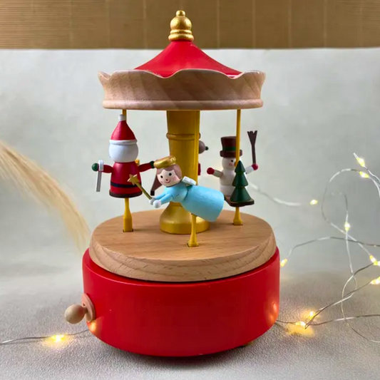 Wooden carousel toy with Santa Claus, snowman, and other characters with music box.
